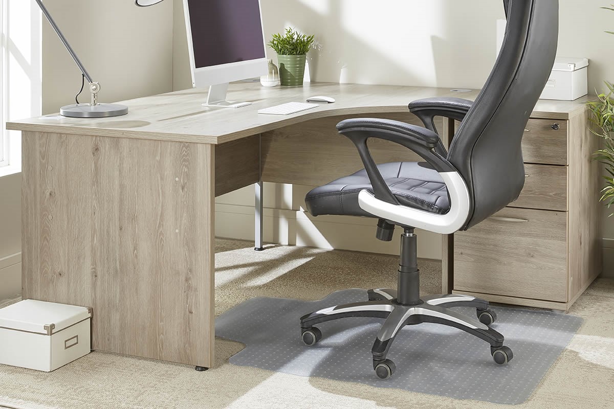 An office chair sat on top of a chair mat to help protect the carpet