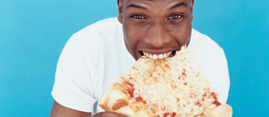 man eating pizza slice