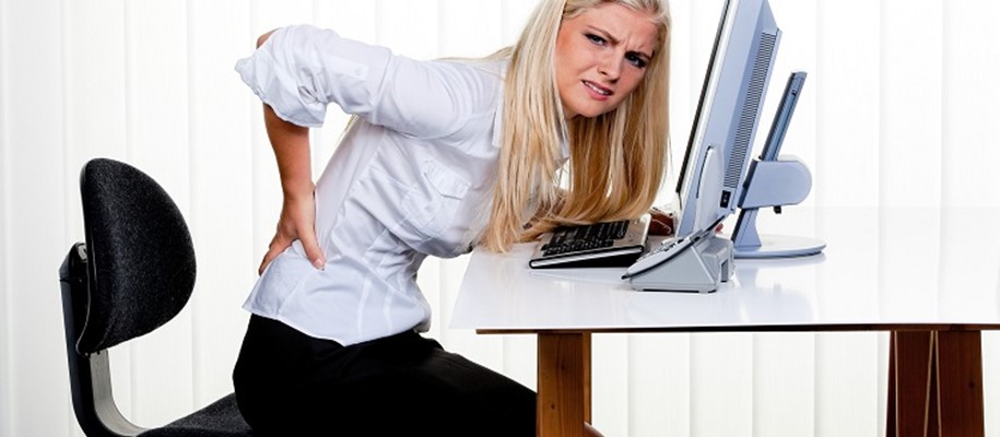 women sitting poorly on office chair
