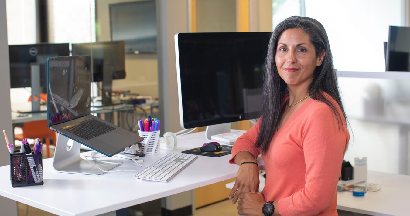 woman using standing office desk