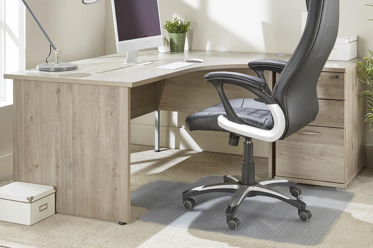 An office chair sat on top of a chair mat to help protect the carpet